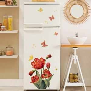 Detail of floral butterfly wall stickers with red tulips on a white refrigerator surface