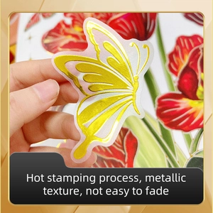 Close-up of golden butterfly wall sticker with metallic texture and gilding detail