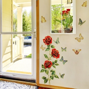 Detail of wall stickers featuring red blooming roses and colorful gold-edged butterflies