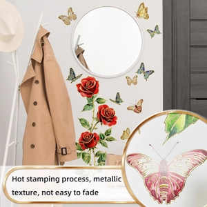 Close-up of golden hot stamping details on red rose and butterfly wall stickers