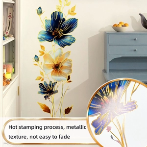 Detail of hot stamping process on blue floral wall stickers with metallic gold texture