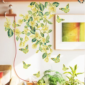 Detail of creative yellow flower wall stickers with butterfly accents in a bright living room