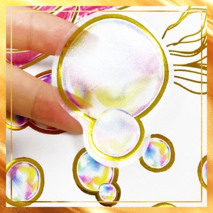 Detail of transparent iridescent bubble stickers with gold foil edges for DIY decoration