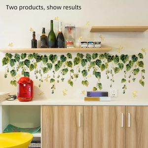 Detail of green vine wall decals with gold dragonflies applied to a kitchen wall