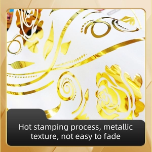 Detailed macro view of gold foil floral rose sticker with elegant metallic finish