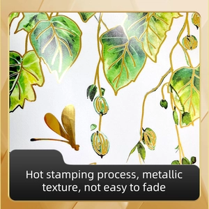 Detail of hot stamping process on green leaf wall sticker with golden metallic texture