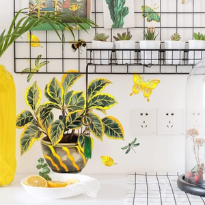 Watercolor potted plant wall stickers with golden leaves and butterflies on a white wall