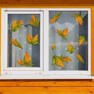 Detail view of harvest corn window stickers with vibrant yellow and green autumn colors