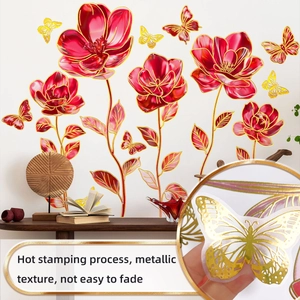 Detail of red floral wall stickers with golden foil butterfly accents for home decor
