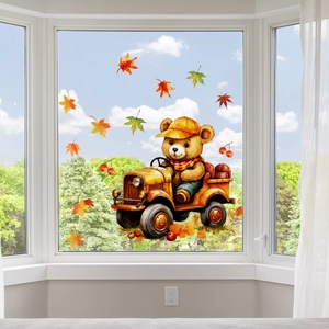 Autumn window decal featuring a cartoon bear driving a truck with maple leaves