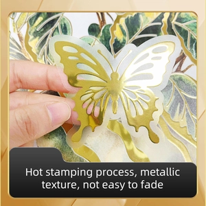 Detail of butterfly wall sticker featuring gold hot stamping process and metallic texture