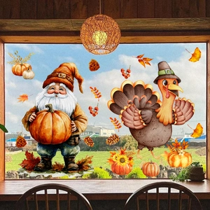 Close-up of Thanksgiving gnome and turkey window decals on a sunlit rustic window pane