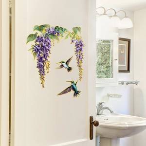 Floral wisteria and hummingbird wall decals with gold edges on white bathroom door