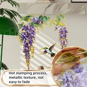Detail of hot stamping process on floral wall sticker with metallic texture and bird design