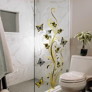 Golden and black floral vine wall decals with 3D butterflies on a glass door