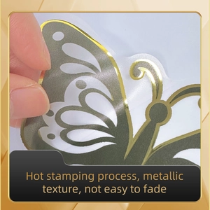 Detail showing hot stamping butterfly wall sticker with metallic gold texture and flexibility