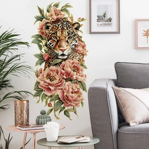 Detail of leopard and pink floral wall sticker with gold edges in a modern living room