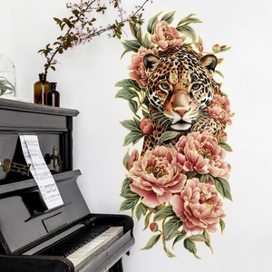 Detail of leopard and peony wall sticker with gold edges on a white bedroom wall
