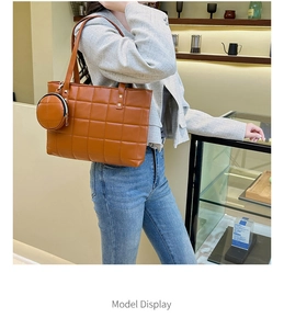 Brown quilted lattice tote bag with matching round coin purse shown in a cafe setting