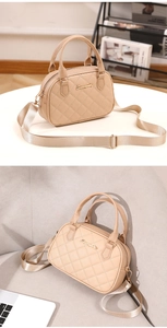 Macro view of beige quilted handbag with gold logo and wide nylon shoulder strap