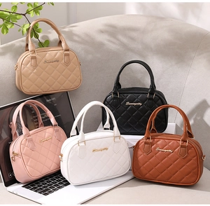 Detailed group view of shell bags in five colors with quilted texture and gold metal logo