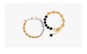 Close-up of brass pearl bead bracelets with S925 silver tag and toggle clasp details