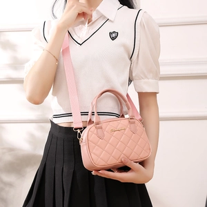 Pink quilted shell handbag with wide fabric strap and golden logo for women