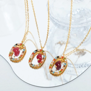 Three-piece gold titanium necklaces with multi-color crystal rings and red agate drops