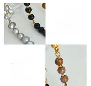 Detail of beaded bracelet with grey freshwater pearls and 18K gold plated steel chain