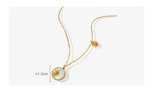 Detail of a 1.5cm white shell daisy pendant on a gold titanium steel paperclip chain