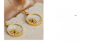 Macro detail of chic daisy pendant necklace with white shell inlay and paperclip chain