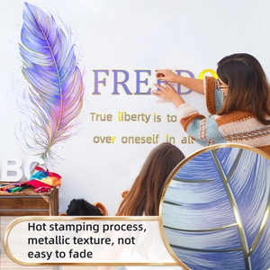 Detail of hot stamping purple feather wall sticker with metallic texture and Freedom text