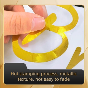 Close-up showing the peeling of a flexible gold metallic wall sticker with hot stamping