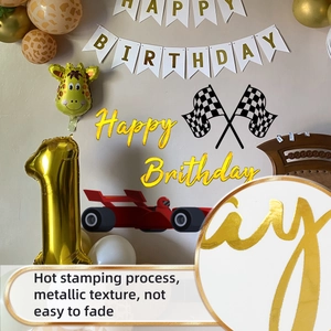 Detail of gold foil Happy Birthday banner and racing car party decoration kit