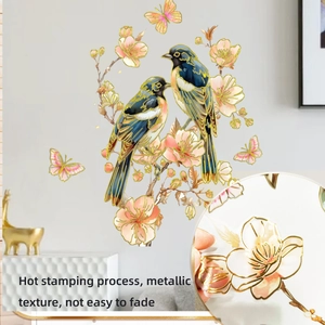 Macro view of hot stamping flower and bird wall stickers with golden metallic texture
