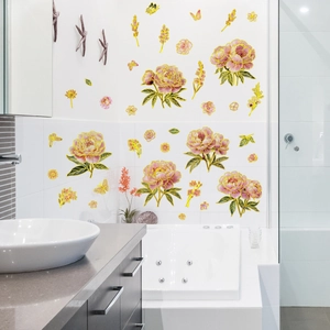 Detail of pink peony wall stickers with gold edges applied to modern bathroom tiles
