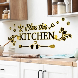 Macro shot of gold and black Bless this KITCHEN wall decals on a kitchen backsplash