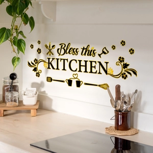Detail of Bless this KITCHEN wall sticker with gold cutlery and floral accents in a kitchen