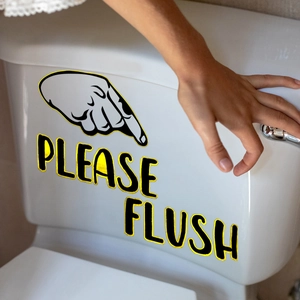 Detail of waterproof 'PLEASE FLUSH' sticker with yellow hand icon on a toilet tank