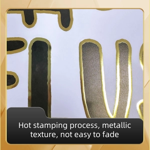 Macro shot of gold foil lettering detail on waterproof bathroom toilet stickers