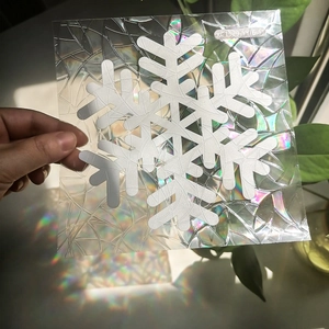 Snowflake suncatcher window decal with rainbow prism effect for Christmas home decor