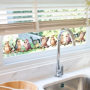 Detail of sparrow and floral branch static window stickers on modern kitchen glass