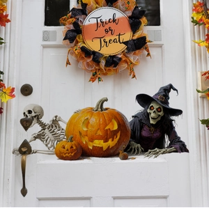 Halloween door stickers featuring pumpkin, skeletons and Trick or Treat decorative wreath