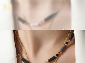 Détail d'un collier bohème avec perles en pierre naturelle et chaîne dorée en titane