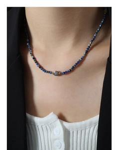 Lapis lazuli and labradorite beaded necklace worn with a blazer for a refined look