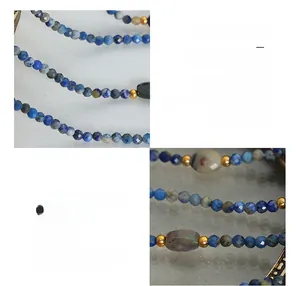 Detail of bohemian multilayered necklace with faceted blue-grey stones and 18K gold-plated beads