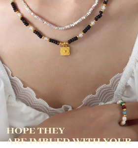 Layered natural stone necklaces with heart relief pendant and gemstone bead ring on model