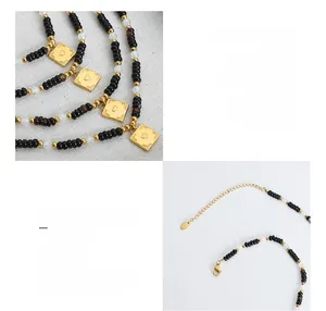Detail of 18K gold-plated titanium steel square heart pendant and beaded chain necklace