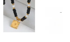 Close-up of bohemian heart relief pendant with black beads in a velvet jewelry box