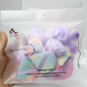 Portable makeup sponge set with various colors and shapes in a clear zippered pouch